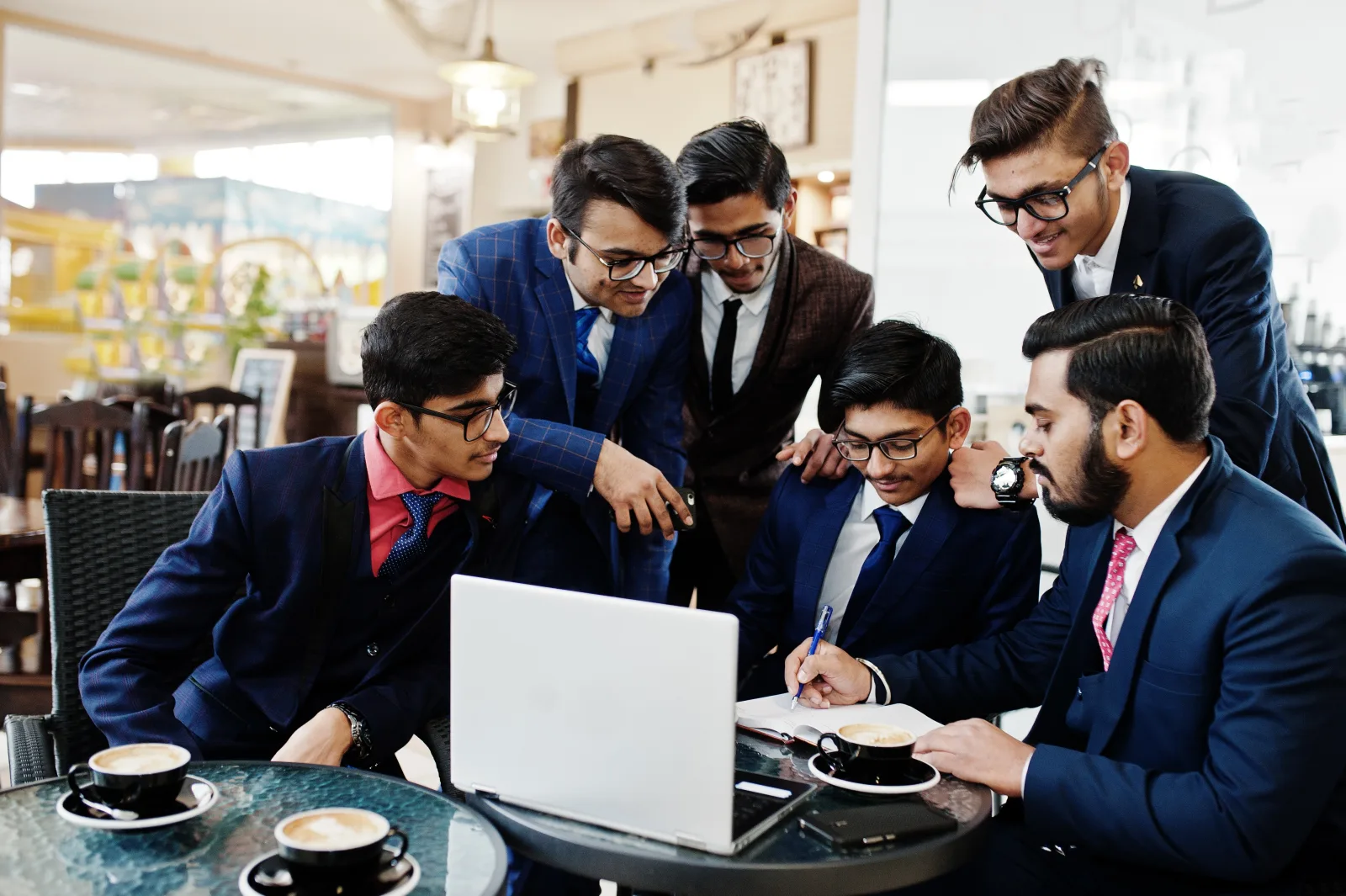 collaborative-process-indian-business-mans-brainstorming-meeting-officediverse-team-young-people-dressed-suits-cooperating-developing-common-project.webp